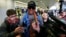 FILE - Former NBA basketball player Dennis Rodman talks to the media at the Beijing International Airport.