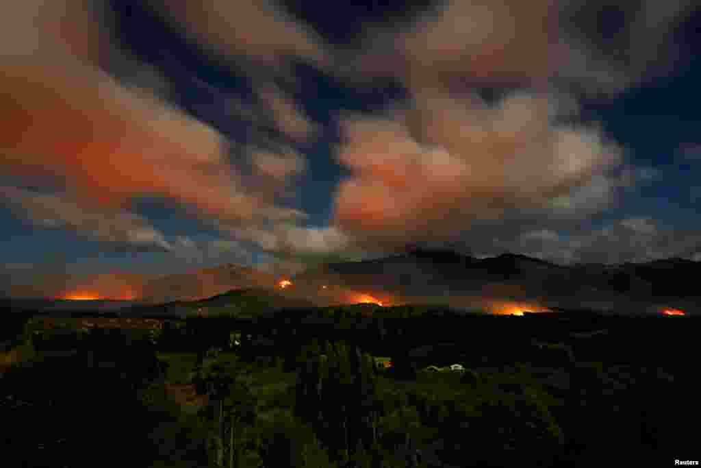 Flames and smoke rise from a wildfire in Epuyen, in the Patagonian region of Chubut, Argentina.