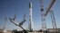 FILE - A Proton-M rocket, a Russian heavy lift launch vehicle, is installed at Baikonur launch pad in Kazakhstan, May 13, 2014.
