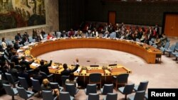 FILE - United Nations Security Council members vote on a resolution at U.N. Headquarters in New York, Dec. 21, 2018. 