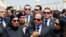 In this picture taken June 30, 2015, and provided by the office of the Egyptian Presidency, Egyptian president Abdel-Fattah el-Sissi (C) speaks at the funeral for Hisham Barakat, surrounded by the latter's family members.