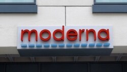 FILE - A sign marks an entrance to a Moderna, Inc., building, in Cambridge, Mass., May 18, 2020.