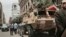 FILE - Soldiers atop military vehicles are seen patrolling near a church in downtown Cairo, Egypt, April 10, 2017.