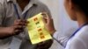 Officials of Union Election Commission count ballots at a polling station in Yangon, Myanmar, April 1, 2017. 