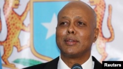 FILE - Somalia's Prime Minister Abdiweli Sheikh Ahmed delivers his speech at the Parliament Building in Mogadishu, Dec. 21, 2013. 