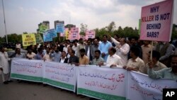 FILE - Pakistani protesters demand a trial for American diplomat involved in a vehicle crash that killed a person, in Islamabad, April 10, 2018. In a second accident involving a U.S. diplomat, which occurred April 29, 2018, Pakistani authorities have charged a U.S. Embassy security officer with trying to obstruct an investigation.