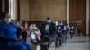 Health care workers await doses to start vaccinating people with Pfizer vaccines at the Bertha Gxowa Hospital in Germiston, South Africa, May 17, 2021. 