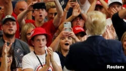 Supporters cheer for President Donald Trump at a rally in Fargo, North Dakota, June 27, 2018. 