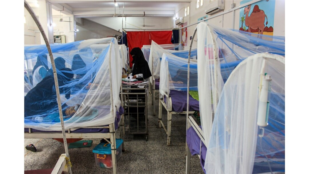 FILE - Women wait with children in a ward at a malnourishment treatment center in Yemen's northern Hajjah province, Nov. 22, 2020.