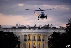 President Donald Trump arrives back at the White House aboard Marine One, Oct. 5, 2020, after being treated for COVID-19 at Walter Reed National Military Medical Center.