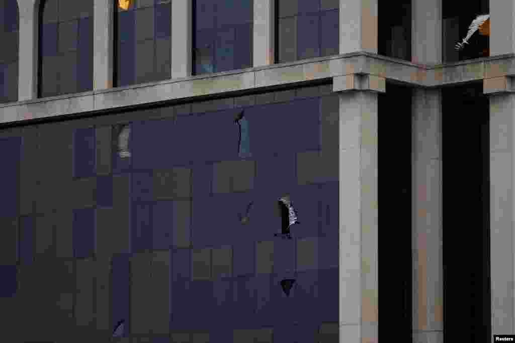 Broken windows on a building are pictured as Hurricane Milton approaches Sarasota in Florida, Oct. 9, 2024.&nbsp;