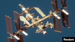 FILE - A satellite image shows an overview of the International Space Station with the Boeing Starliner spacecraft, June 7, 2024. (Maxar Technologies/Handout via REUTERS)