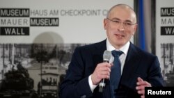 Freed Russian former oil tycoon Mikhail Khodorkovsky speaks during his news conference in the Museum Haus am Checkpoint Charlie in Berlin, December 22, 2013. 