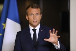 FILE - French President Emmanuel Macron speaks during a press conference after the 74th Session of the United Nations General Assem.bly at the French mission to the UN in New York, Sept. 24, 2019
