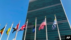 Flags of some member countries fly outside the United Nations headquarters building in New York, Sept. 28, 2019.