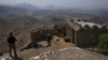 FILE - Pakistan Army troops observe the area from a hilltop post on the Pakistan-Afghanistan border in Khyber district, Pakistan, Aug. 3, 2021.