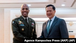 Cambodian Prime Minister Hun Manet, right, shakes hands with Gen. Ronald P. Clark, left, the commanding general of U.S. Army Pacific, left, during a welcome meeting at the Peace Palace in Phnom Penh, Cambodia, Feb. 24, 2025. 