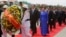 Vietnamese President Tran Dai Quang, center left, and his wife, center right, walk during a ceremony to pay respect at a statue of Cambodian late King Norodom Sihanouk, in Phnom Penh, Cambodia, Wednesday, June 15, 2016. Tran Dai Quang is on a two-day off