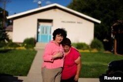 Immigrant Rosa Sabido, 53, left, who lives in sanctuary in the United Methodist Church while facing deportation, says goodbye to her mother, Blanca Estela Valdivia, 70, in Mancos, Colorado, July 19, 2017.