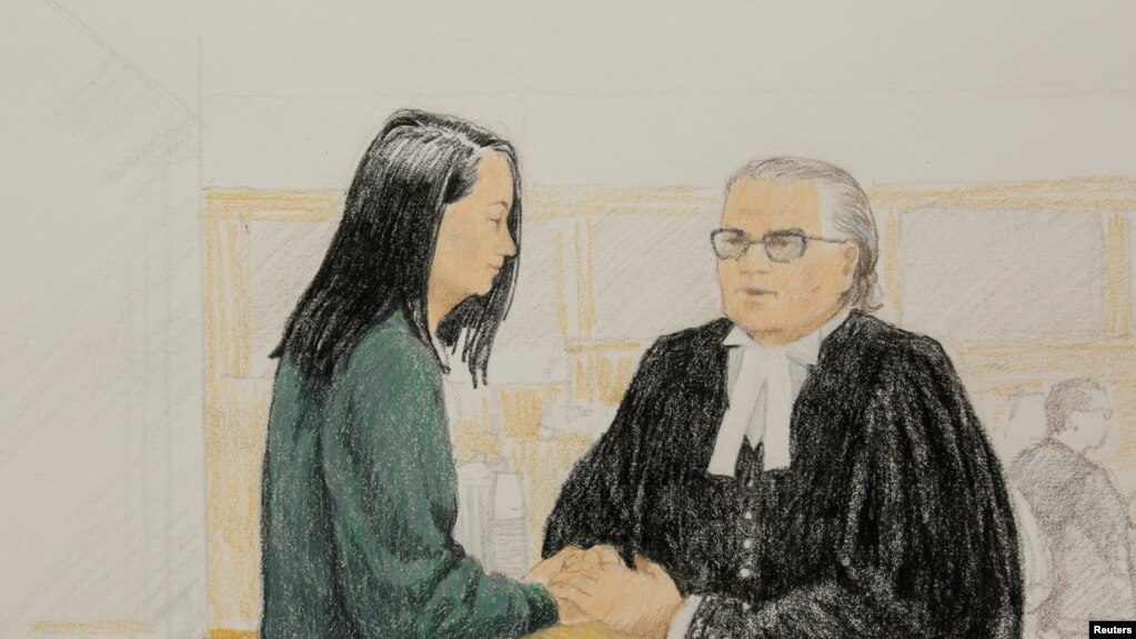 孟晚舟和她的律师周一在法庭上。为了让孟晚舟获得保释，她的律师戴维·马丁提出愿意接受严格的监控措施作为保释条件。（2018年12月10日）