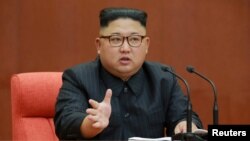 FILE - Kim Jong Un speaks during the Second Plenum of the 7th Central Committee of the Workers' Party of Korea (WPK) at the Kumsusan Palace of the Sun, in this undated photo released by North Korea's Korean Central News Agency (KCNA) in Pyongyang, Oct. 8, 2017.