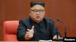 FILE - Kim Jong Un speaks during the Second Plenum of the 7th Central Committee of the Workers' Party of Korea at the Kumsusan Palace of the Sun, in this undated photo released by North Korea's Korean Central News Agency (KCNA) in Pyongyang, Oct. 8, 2017.
