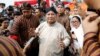 FILE - Prabowo Subianto, challenger to incumbent President Joko Widodo, leaves a ceremony marking the start of the campaigning period for next year's election in Jakarta, Indonesia, Sept. 23, 2018. 