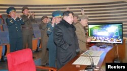 North Korean leader Kim Jong Un reacts as he watches a long range rocket launch in this undated photo released by North Korea's Korean Central News Agency (KCNA) in Pyongyang, Feb. 7, 2016.