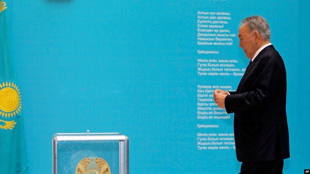 Kazakhstan's President and the main presidential candidate Nursultan Nazarbayev walks to casts his ballot at a polling station in Astana, the capital of Kazakhstan, Sunday, April 26, 2015.