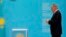 FILE - Nursultan Nazarbayev, Kazakhstan's president, walks to casts his ballot at a polling station in Astana in the country's last presidential election, April 26, 2015.