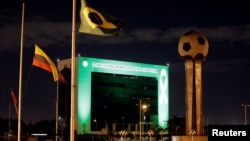 The headquarters of the South American Football Confederation (CONMEBOL) in Luque, Paraguay, is lit up in green to pay tribute to members of Chapecoense soccer team involved in the plane crash in Colombia, Nov. 30, 2016.