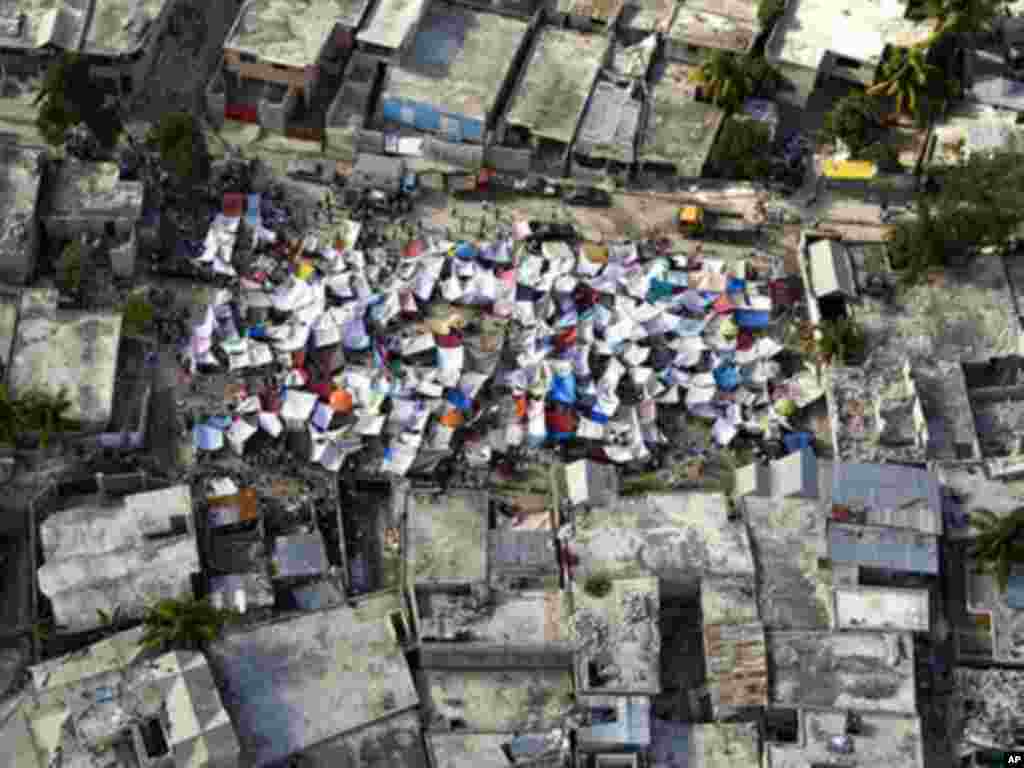 Haitians set up impromtu tent cities thorough the capital after an earthquake measuring 7 plus on the Richter scale rocked Port au Prince Haiti just before 5 pm yesterday, January 12, 2009.