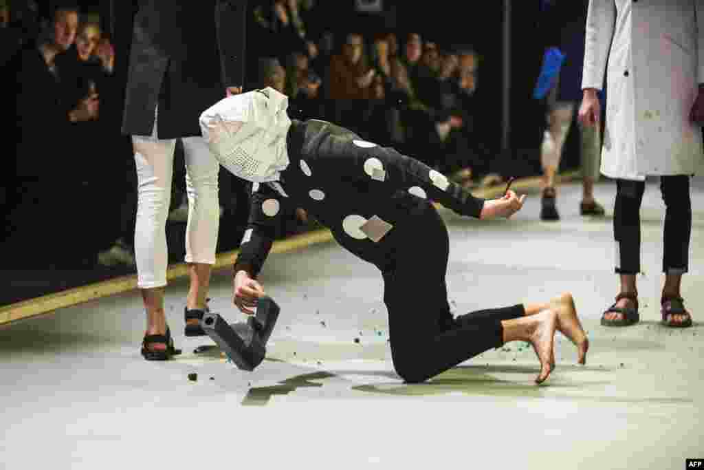 Models present fashion from the Fall/Winter 2015 collection of Danish design house Han Kjobenhavn during the Copenhagen Fashion Week, in Copenhagen, Denmark.