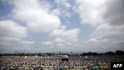 Thousands of faithful attend a mass celebrated by Pope Benedict XVI, at the Hippodrome in Zagreb, Croatia, Sunday, June 5, 2011. Pope Benedict XVI is on two-day visit to Croatia. (AP Photo/Darko Bandic)
