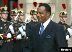 FILE - President of the Republic of Congo Denis Sassou N'Guesso arrives at the Elysee Palace in Paris, Sept. 20, 2002. N'guesso seeks to extend his already three decades in power in elections Sunday.