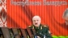 FILE: Belarusian President Alexander Lukashenko attends a meeting with top level military officials in Minsk, Belarus, on Nov. 22, 2021.