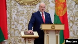 (FILE) Alexander Lukashenko takes the oath of office as President during ceremony in Belarus.