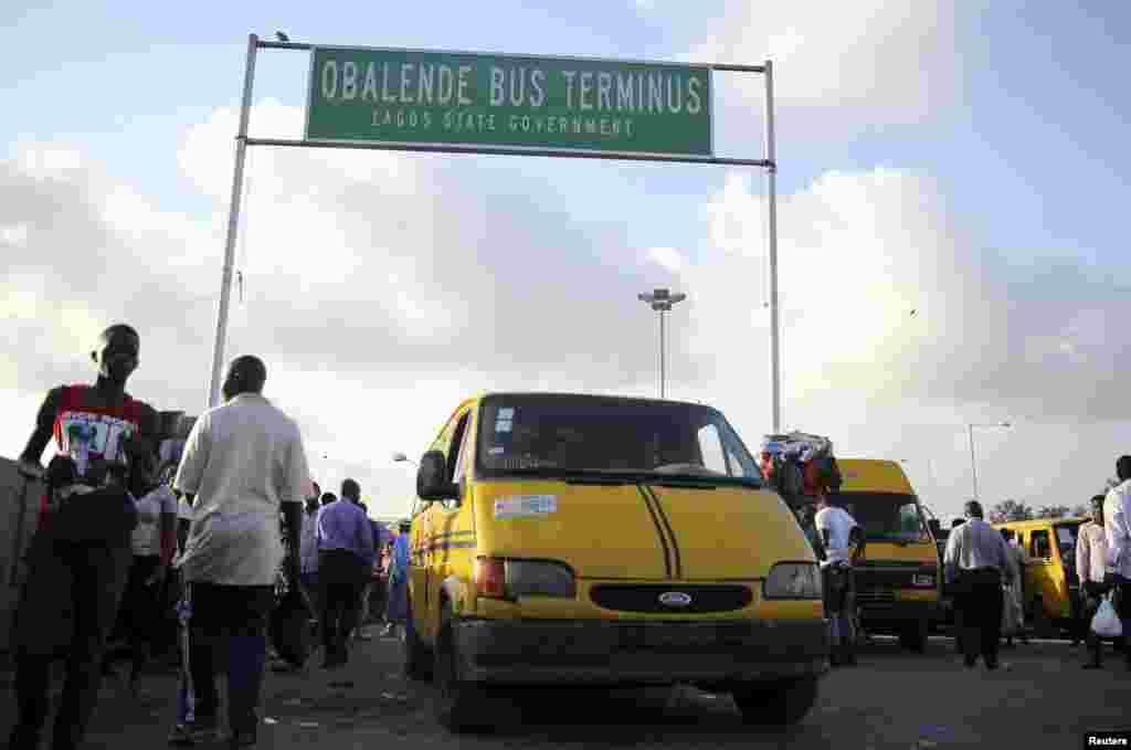 A vehicle used for commercial transportation is driven through a motor park in the Obalende district of Lagos.