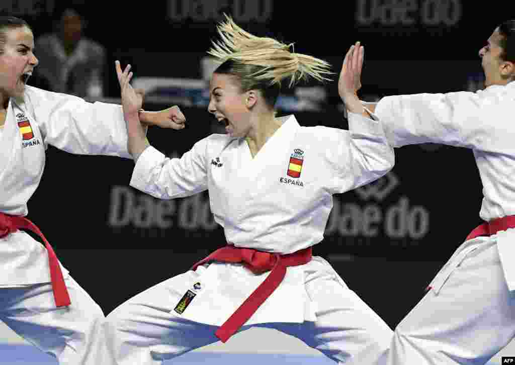 Lidia Rodriguez, Marta Garcia and Raquel Roy of Spain compete in the Kata team female final during the 24th Karate World Championships at the WiZink center in Madrid.