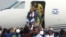 Congolese opposition leader Jean-Pierre Bemba disembarks a plane as he arrives at the N'djili International Airport in Kinshasa, Democratic Republic of Congo, Aug. 1, 2018. 