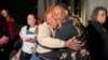 Breonna Taylor's mother, Tamika Palmer, hugs a friend in Louisville, Kentucky, on Nov. 1, 2024, after a former Kentucky police officer was convicted in federal court for using excessive force when he fired his gun during the deadly raid that left Taylor dead in 2020.