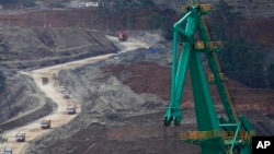 Dump trucks maneuver Indonesia Weda Bay Industrial Park at Central Halmahera, North Maluku province, Indonesia, June 8, 2024.