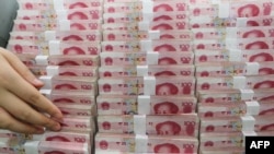 FILE - China's yuan will become Zimbabwe's reserve currency.