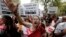 FILE - Demonstrators from All India Democratic Women's Association (AIDWA) hold placards and shout slogans during a protest against the recent killings of two teenage girls, in New Delhi, May 31, 2014. 