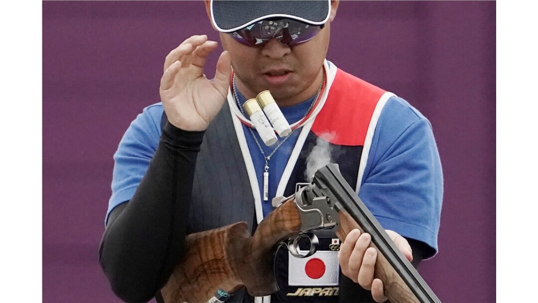 Hiroyuki Ikawa ejects spent cartridge shells as he competes in thew skeet shooting competition of the Tokyo 2020 Olympic Game Shooting test event on May 18, 2021 at Asaka Shooting Range in Tokyo.
