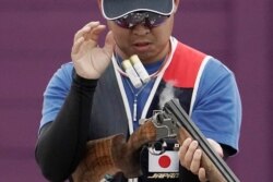 Hiroyuki Ikawa ejects spent cartridge shells as he competes in thew skeet shooting competition of the Tokyo 2020 Olympic Game Shooting test event on May 18, 2021 at Asaka Shooting Range in Tokyo.
