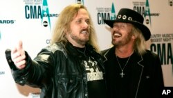 FILE - Johnny Van Zant, left, arrives with his brother Donnie at the 40th Annual CMA Awards in Nashville, Tenn., Nov. 6, 2006. The house where rockers Ronnie, Donnie and Johnny Van Zant grew up is officially one of Florida's historic sites. 