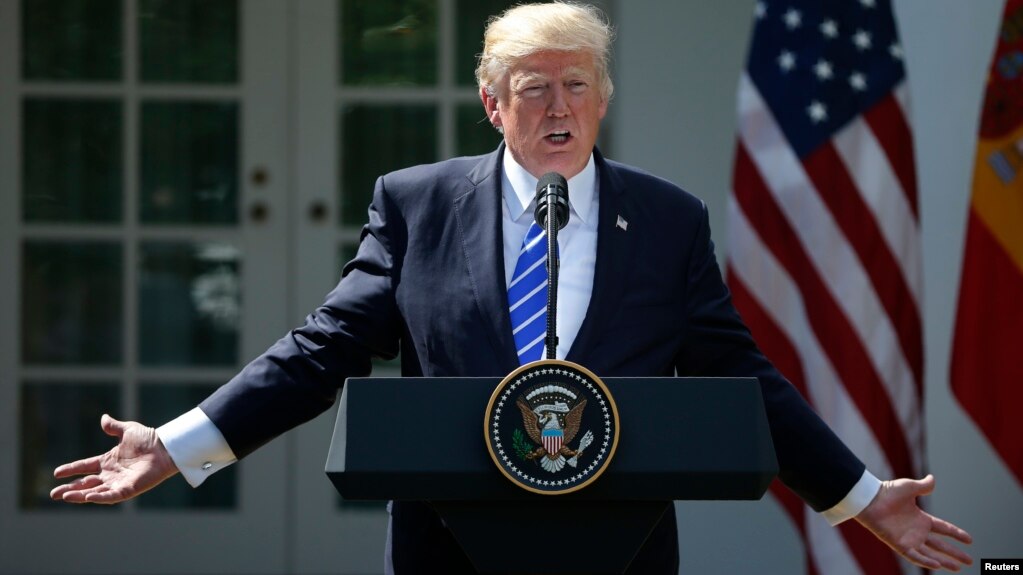 FILE - U.S. President Donald Trump gestures as he speaks during a news conference in the Rose Garden at the White House in Washington, Sept. 26, 2017.