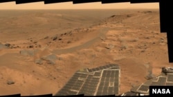 This panorama was acquired by the Spirit Rover from a position in the "Columbia Hills" near the summit of "Husband Hill."