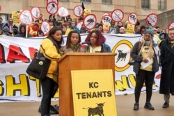 KC Tenants board member Tiana Caldwell (Right) at the podium with her son AJ and director of KC Tenants Tara Raghuveer while he speaks at a KC Tenants rally, pre-COVID. (Photo courtesy Tiana Caldwell)